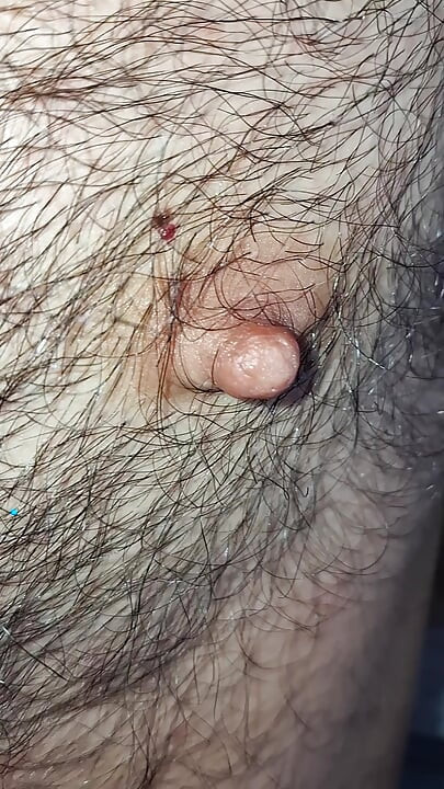 Male nipples in the foreground