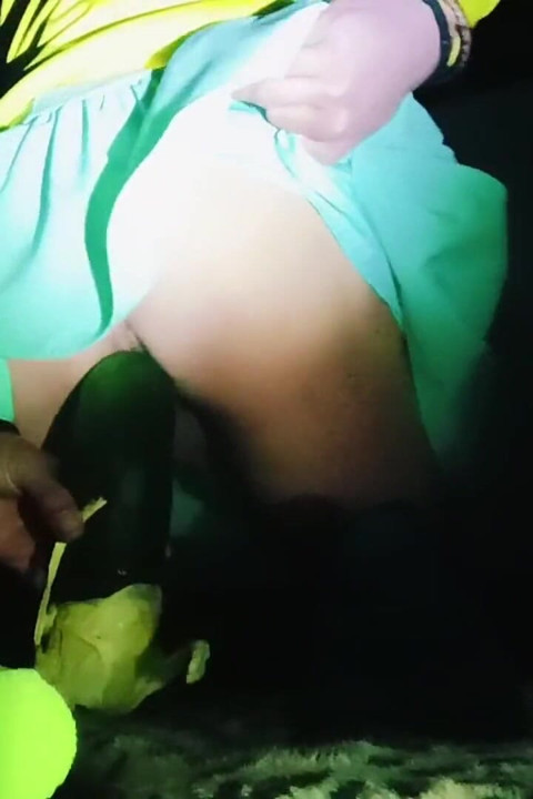 A Young Woman in a Skirt Spreads Her Buttocks Wide.