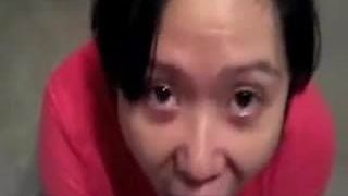 Slanty Eyed Asian Drinking Stranger's Cum