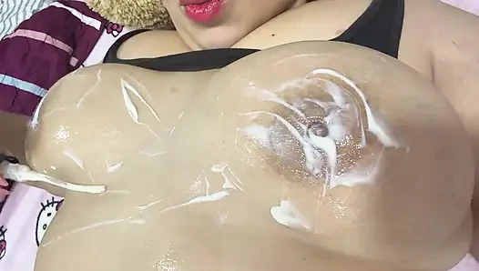 Mom massages her big tits with a very delicious cream