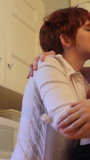 Emotional moment from "Short haired babe licks randy redhead's pussy in the kitchen"