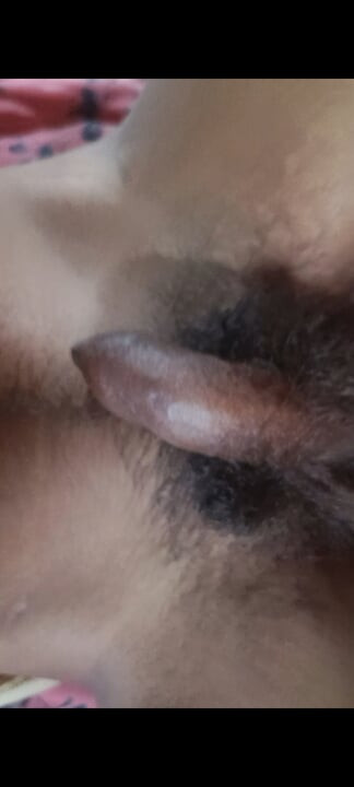 The boy is shaking his penis in his hand and ejaculating.