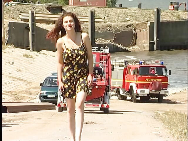 Busty redhead teen lifting dress outdoors