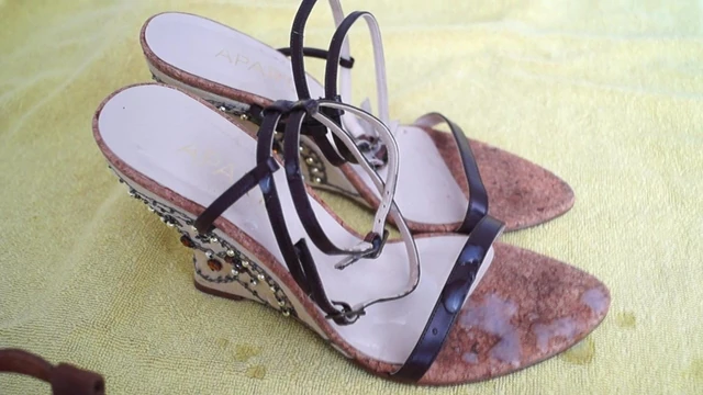 Cumming on strappy cork wedges