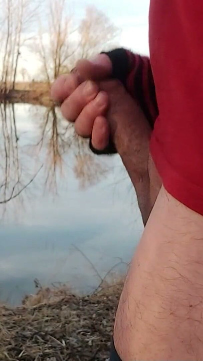 Outside by the lake, jerking off with a band around your cock and balls and showing your asshole | Clip 1