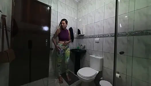 Maid changing clothes in the bathroom.