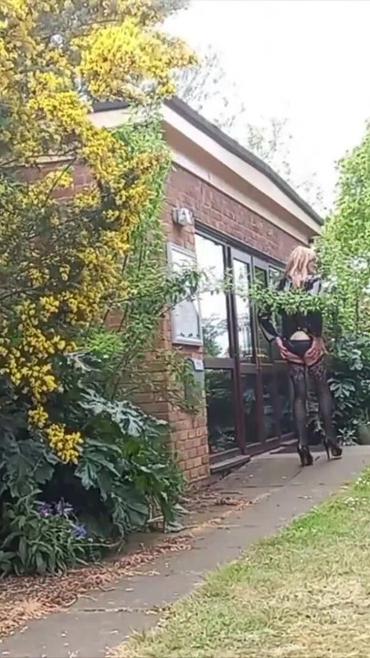 Emotional moment from "Crossdressing Gina Cumming in Panties Outdoors"