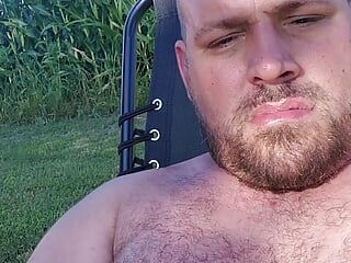 Fat guy strokes his thick cock outside