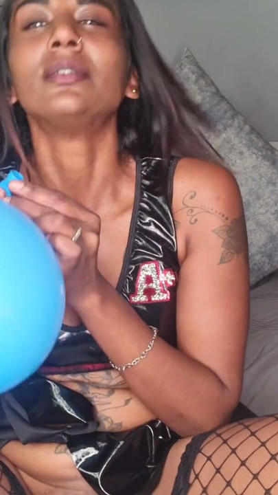 Desi in sexy latex outfit playing with balloons, dirty talking | Clip 1