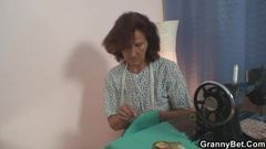 Sewing granny enjoys riding young cock