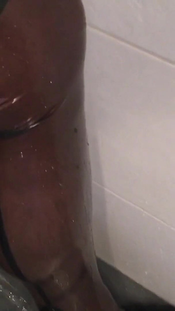 Iconic moment from "Fetish Crossdresser pissing on Latex Stockings"