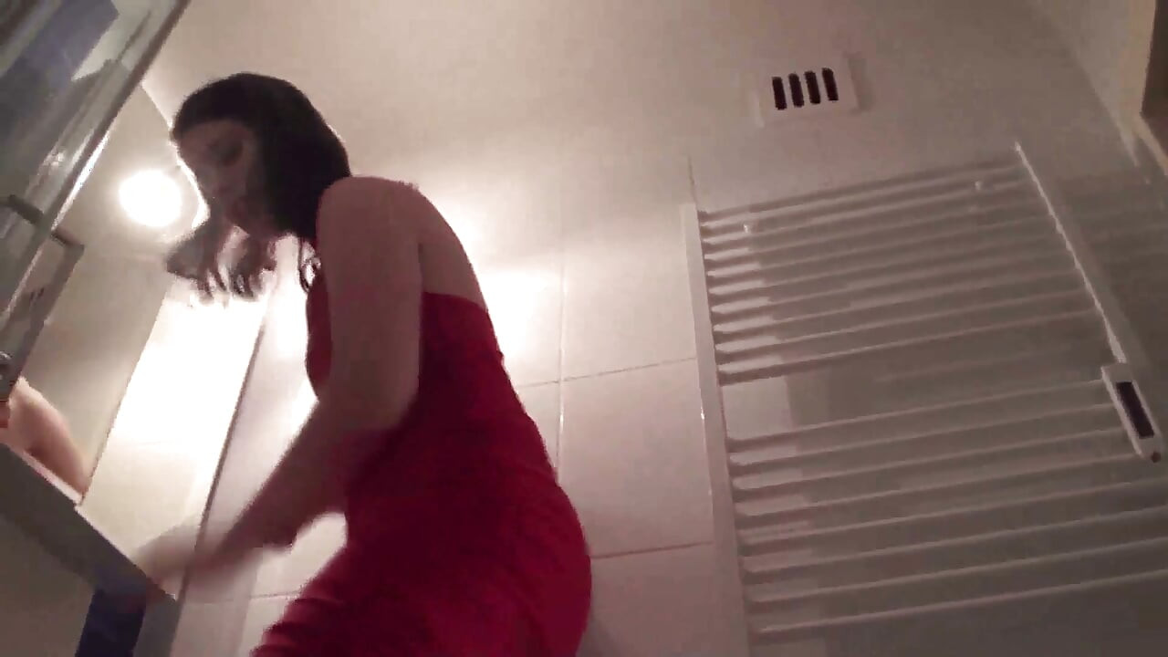Pointed heels crushing human doormat in the bathroom