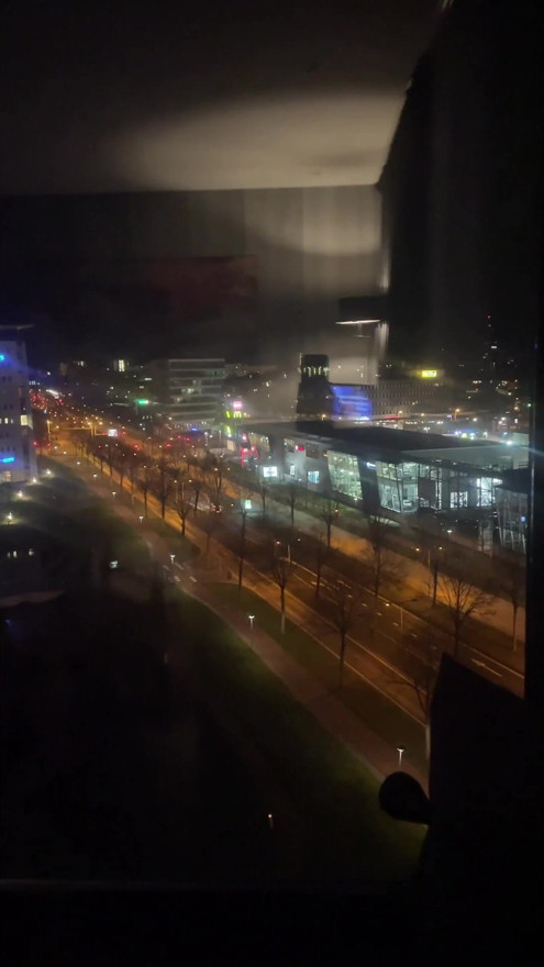 standing naked in front of the hotel window along a busy road | Clip 1