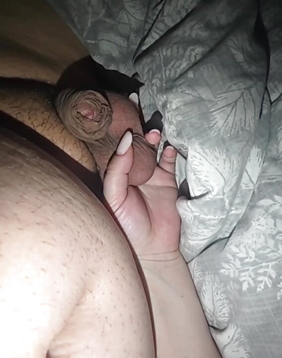 Step mom hand grabs step son big balls and squeeze them hard controlling his erection