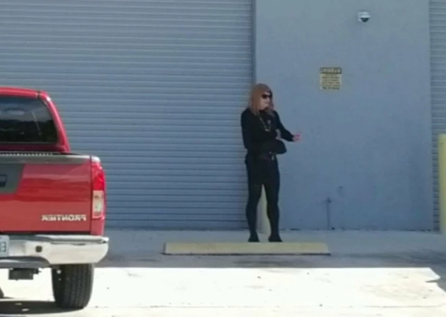 Jessica tranny slut smoking outside adult theater