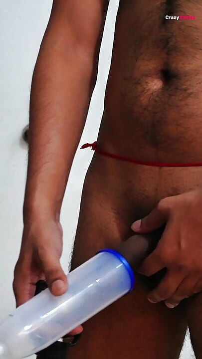 In this video, a penis pump is used to enlarge his cock