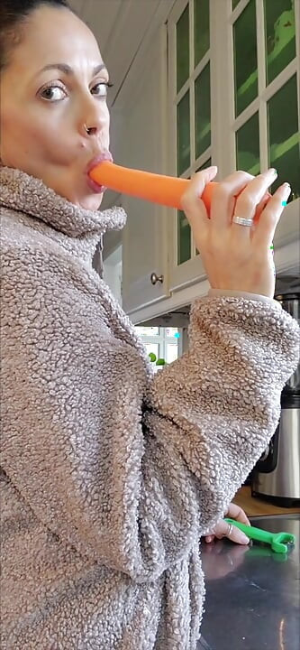 Angelina is cooking with carrots and she can't help treating them with her special spice.