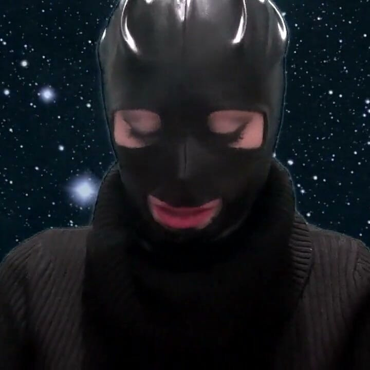 Smoking and teasing you in a latex mask