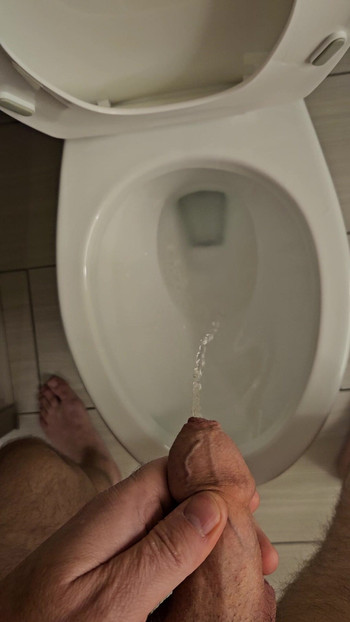 Hard small uncut dick peeing