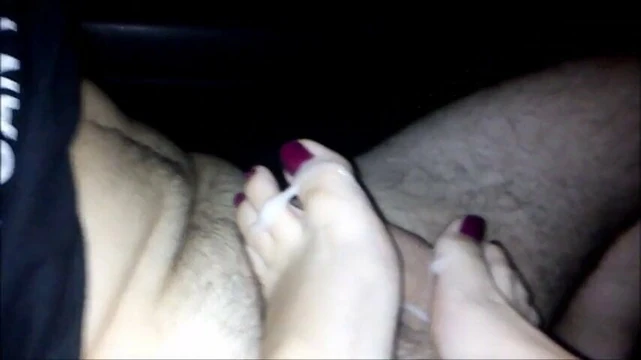 Michelle is milking his cock in the Back seat