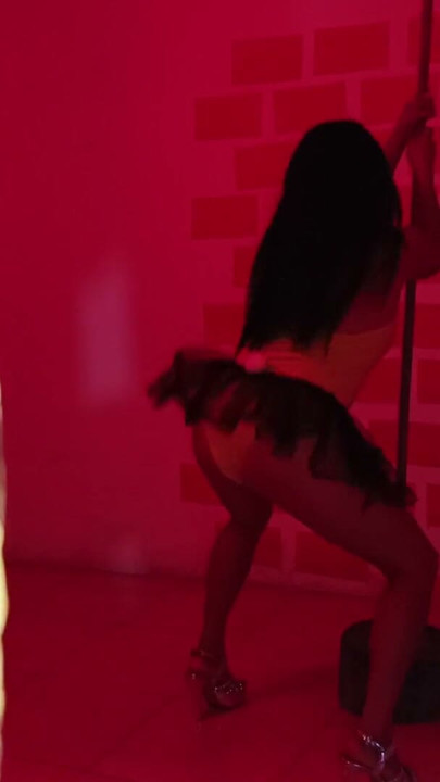 The nightclub has a very sensual Colombian visiting her! She dances beautifully with a customer. | Clip 1