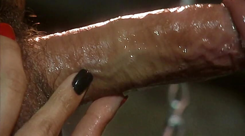 Delivers a steamy blowjob to her slave's cock in a BDSM affair
