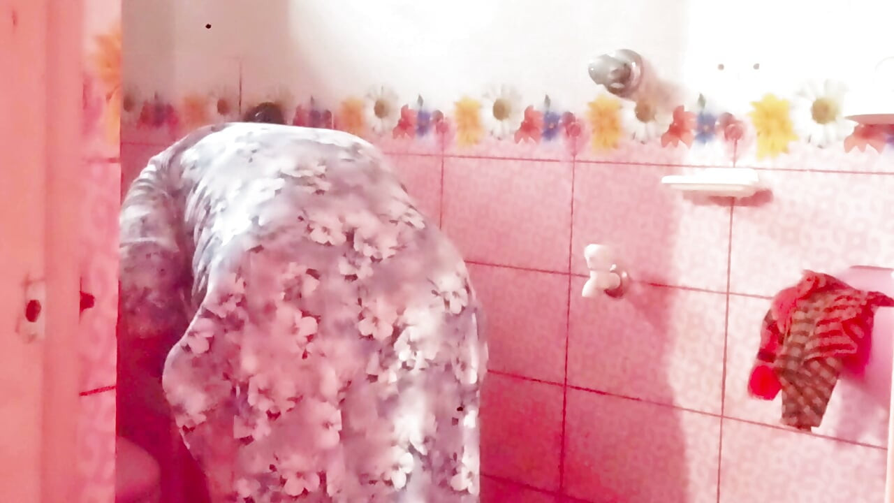 A Bangladeshi-Bihari woman is engaging in romantic sex inside the bathroom while bathing.
