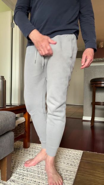 Showing my cock budge in gray sweatpants and then taking my cock out and stroking and showing it. Barefoot in gray sweats playing with my dick and jerking. Showing my thick mushroom head cock.