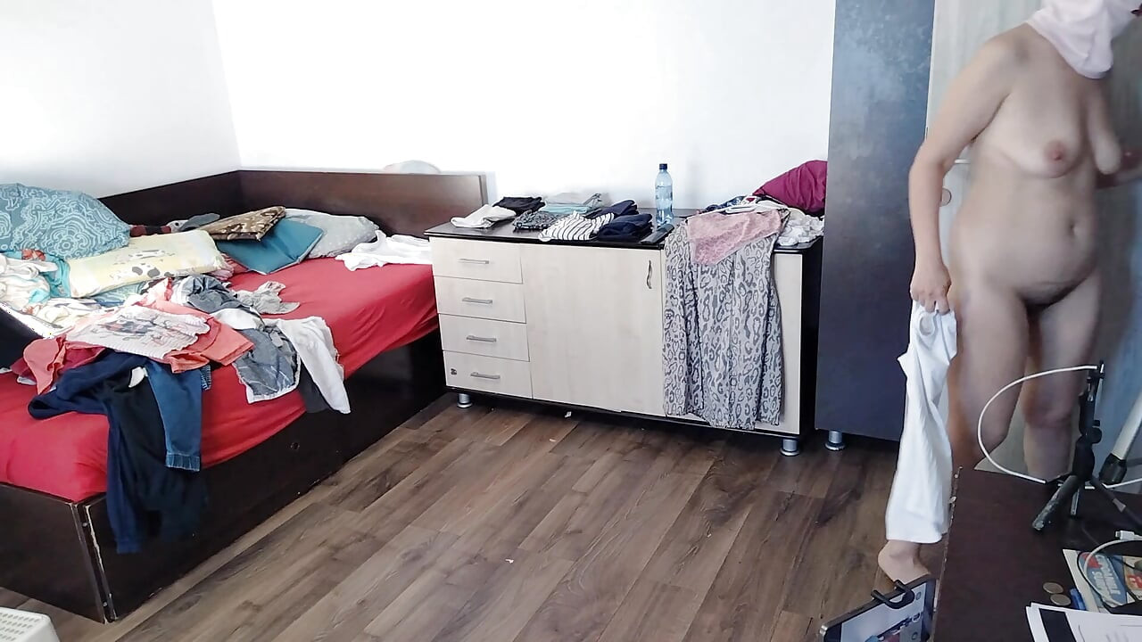 Sexy wife does housework naked. Brunette hairy pussy, big ass, big tits. Sexy mom massages herself with a vibrator.