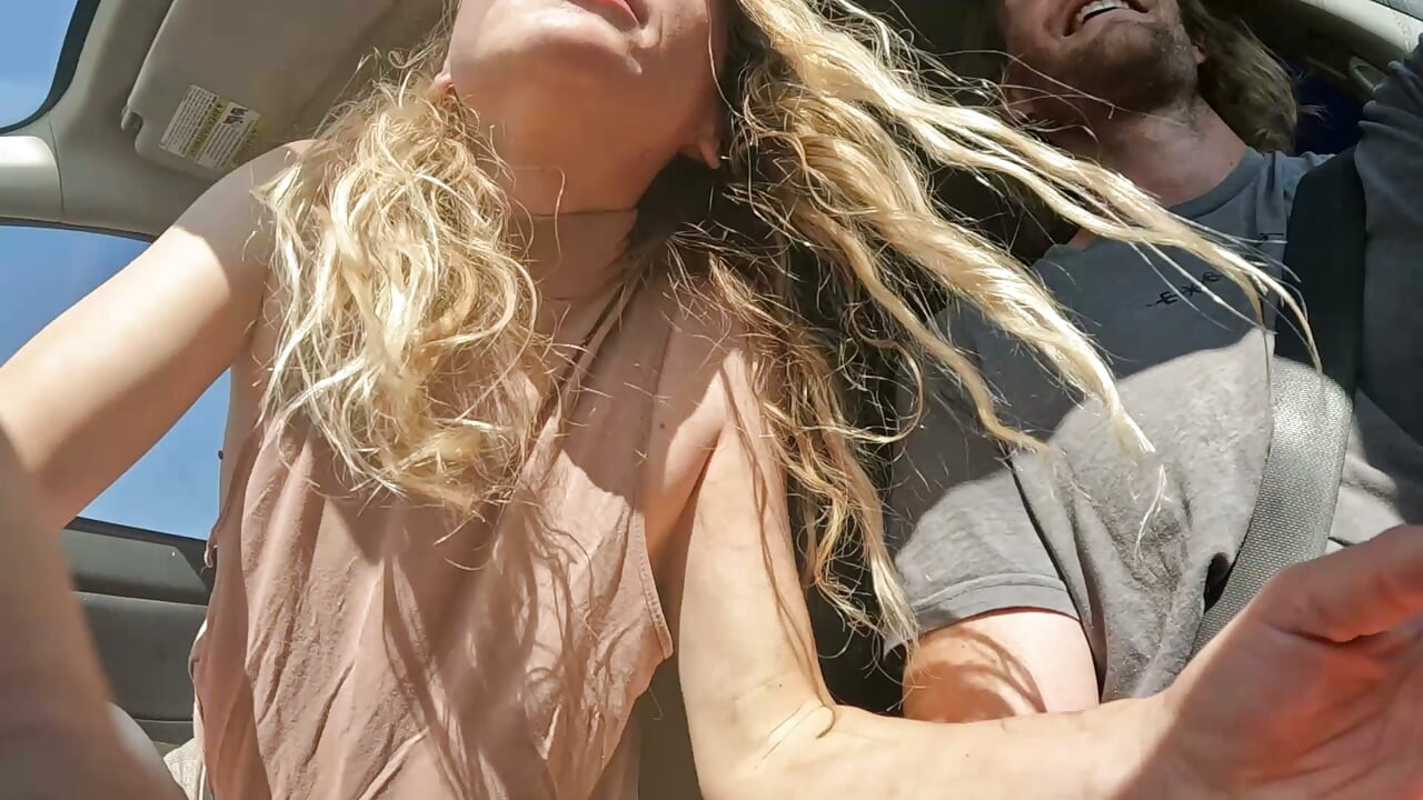 Petite Blonde Gives Her Man Road Head In The Car