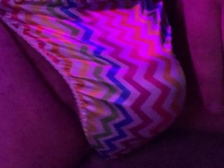 Playing in a little rainbow sissy thong
