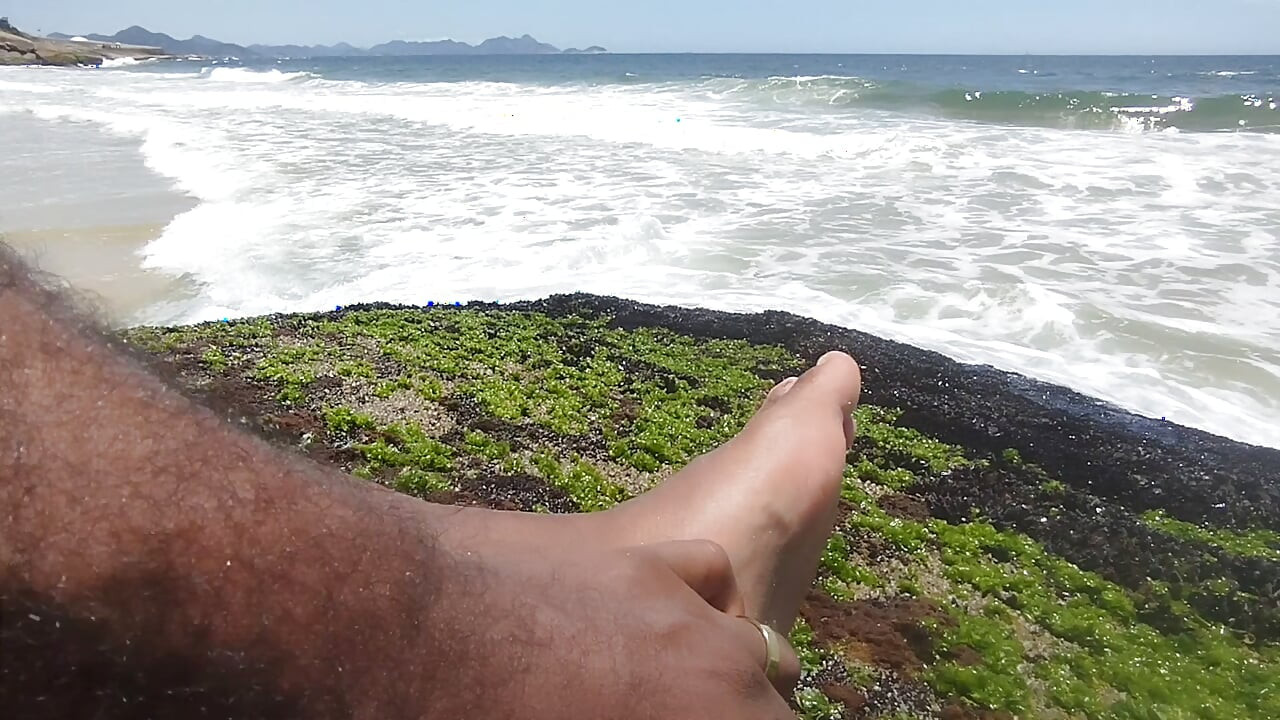 massaging my feet on the beach