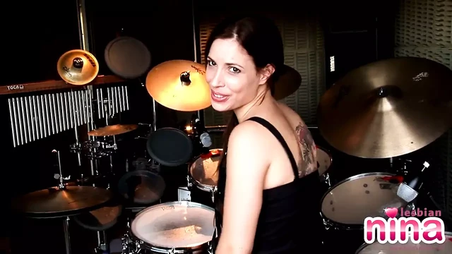 Lesbian Nina with drums showing her perfect body