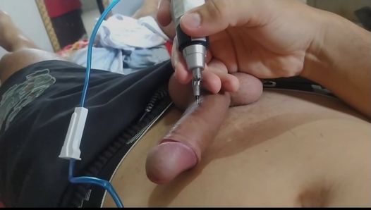 Tattooing his own cock with a needle and homemade machine.