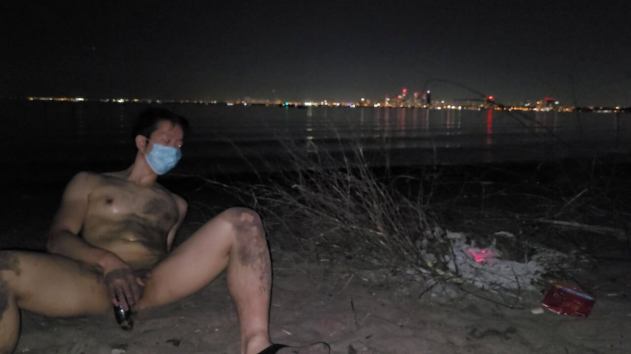oiled masturbating and piss on the nude beach at night
