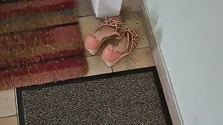 Cum into stil warm shoes of m neighbour in the hallway