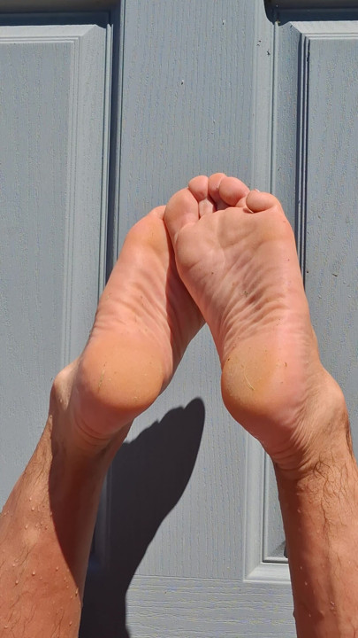 My boyfriend's nice male soles tanning in the sun