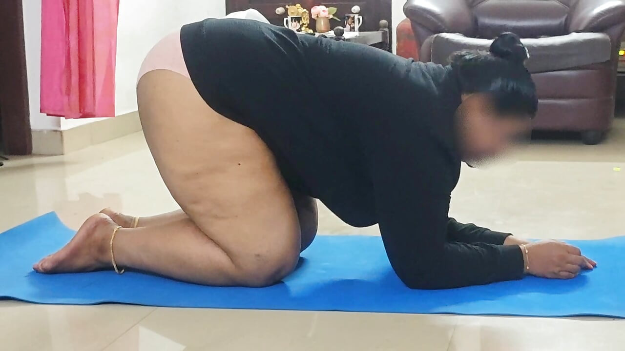 Topless yoga practice of a cute chubby house wife