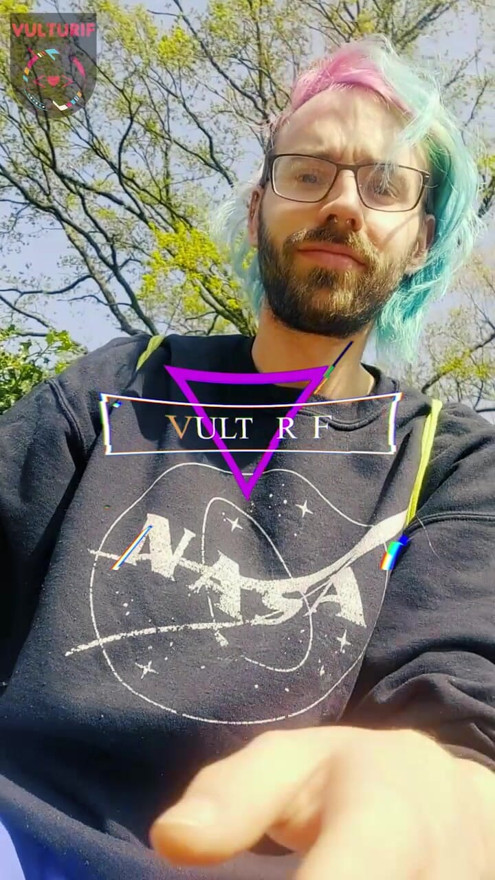 Vulturif wears only their chastity cage and a buttplug under their skirt