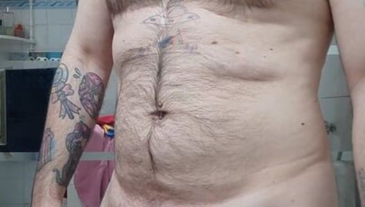 Hairy bear shows off his huge cock and masturbates