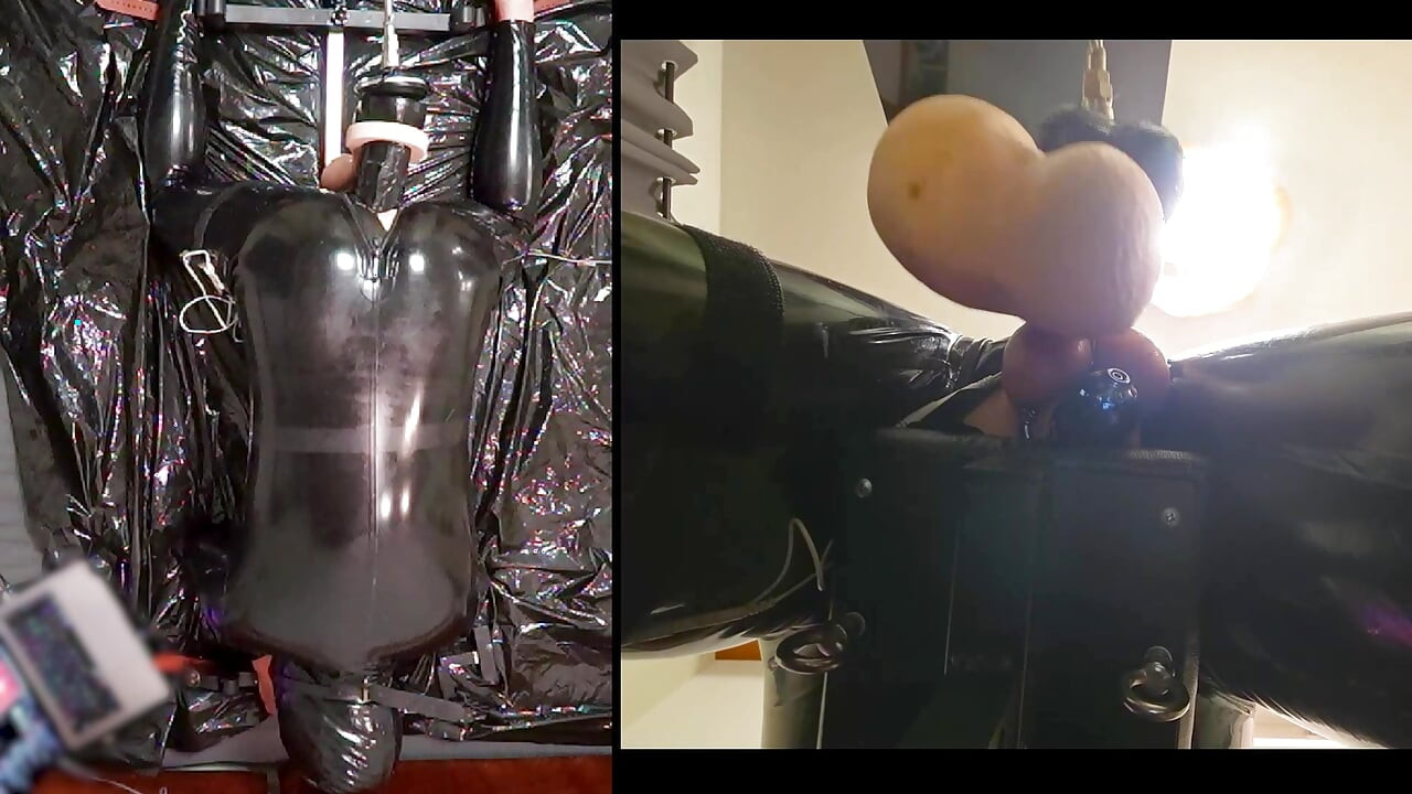 Session in the pillory with Latex Catsuit, PA Chastity, Giant Didildo and Estim