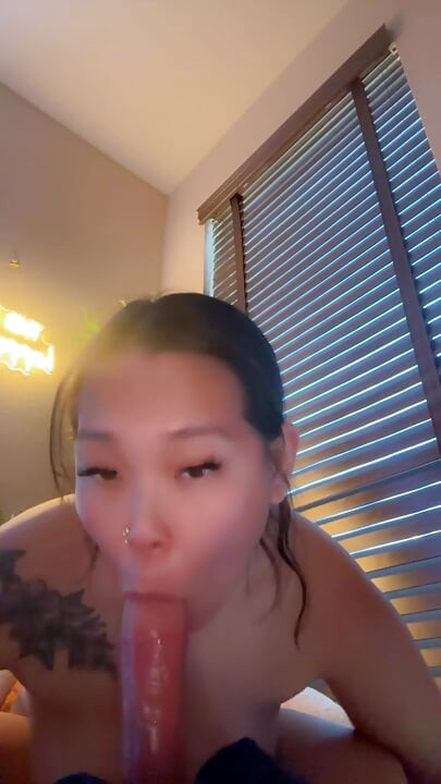 asian mistress gives sloppy dildo blowjob while girlfriend is at work