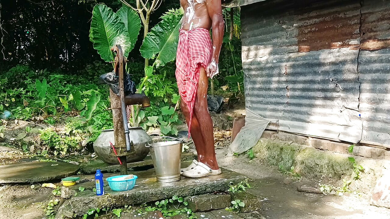 Desi young man bath Open place.