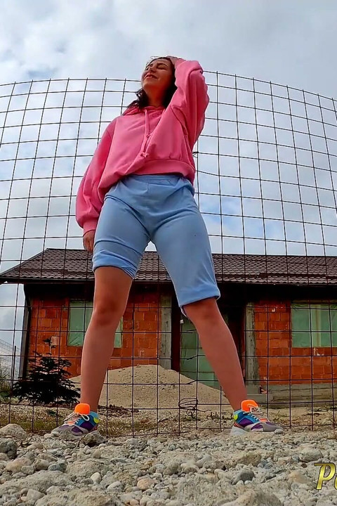 Changing her wet shorts into dry pants