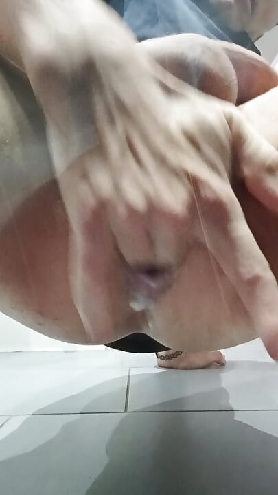 Man fingers his anus with excitement