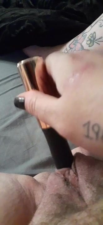 Masturbating