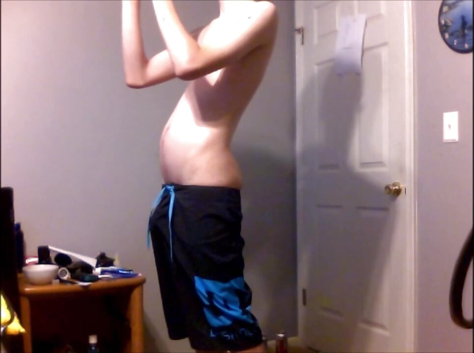 Young Guy Fills His Stomach with Water