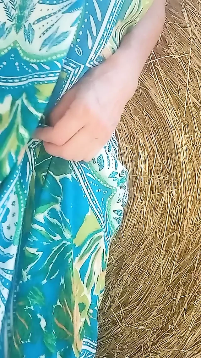 In the countryside: hay bale and red pussy