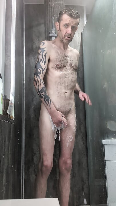 Shower and playing with soft cock