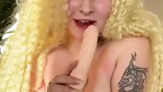 Delicate, Curly, Blonde Fucks Herself with a Double Cock.